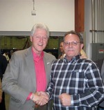 Photograph of Robert Nard and former President of the United States Bill Clinton